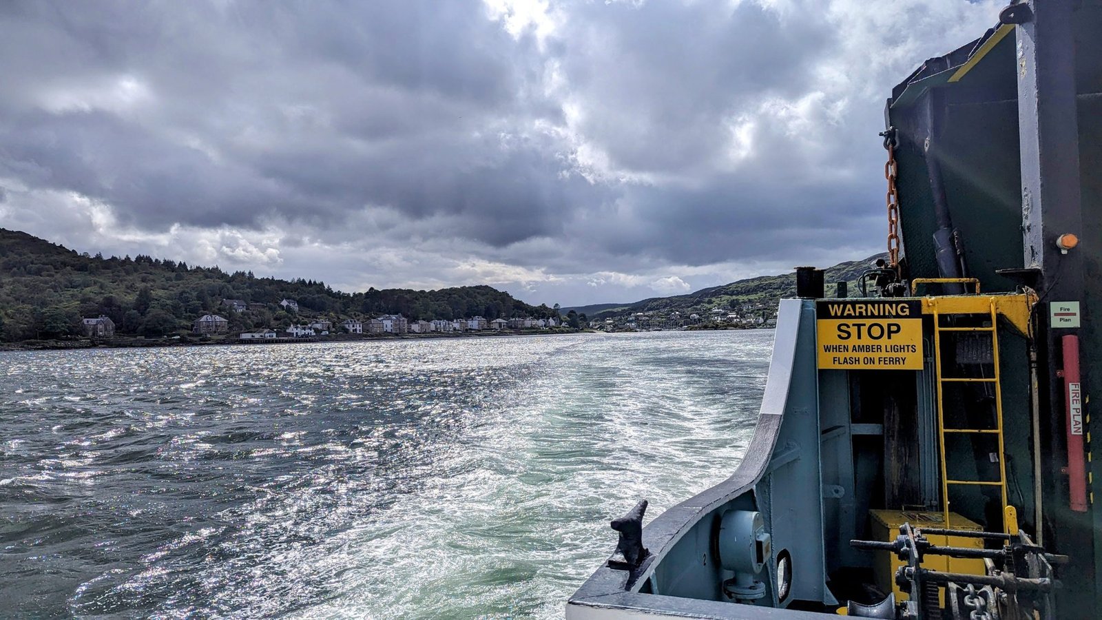 The view over the bow of a CalMac ferry mid-crossing on Loch Fyne.