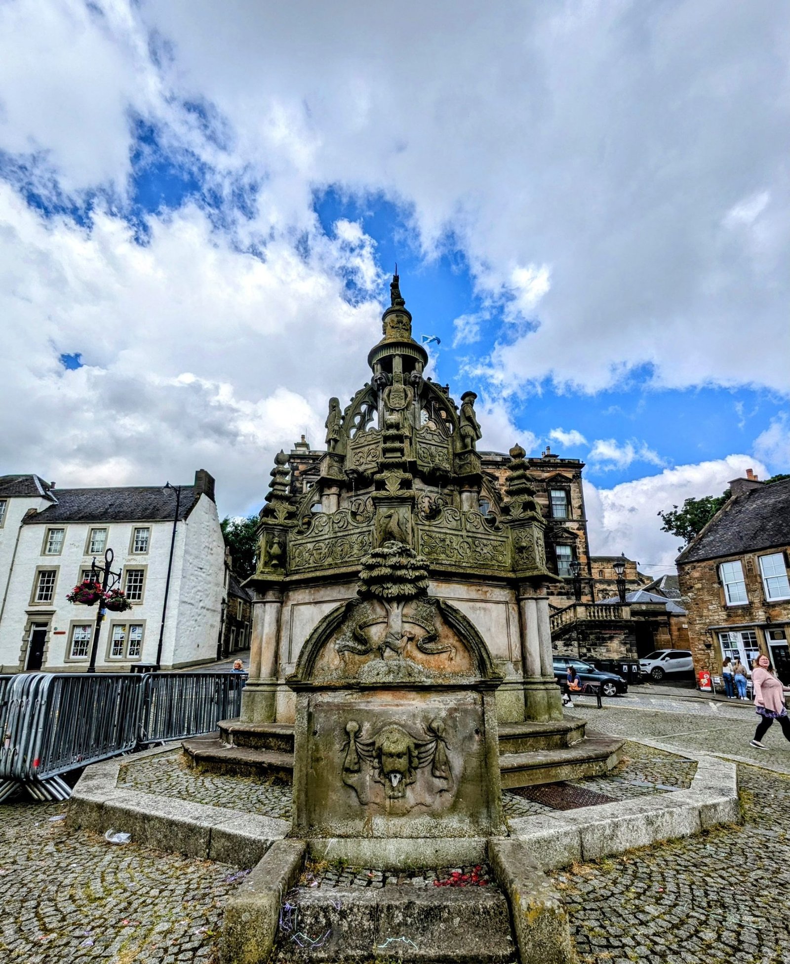 The ornately carved stone Cross Well fountain on the High Street at Linlithgow.