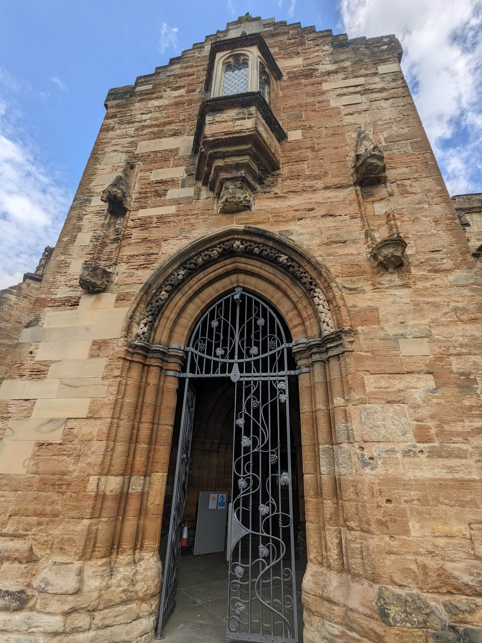 The ornate sandstone entrance and clock tower of St Michael's Church, Linlithgow.