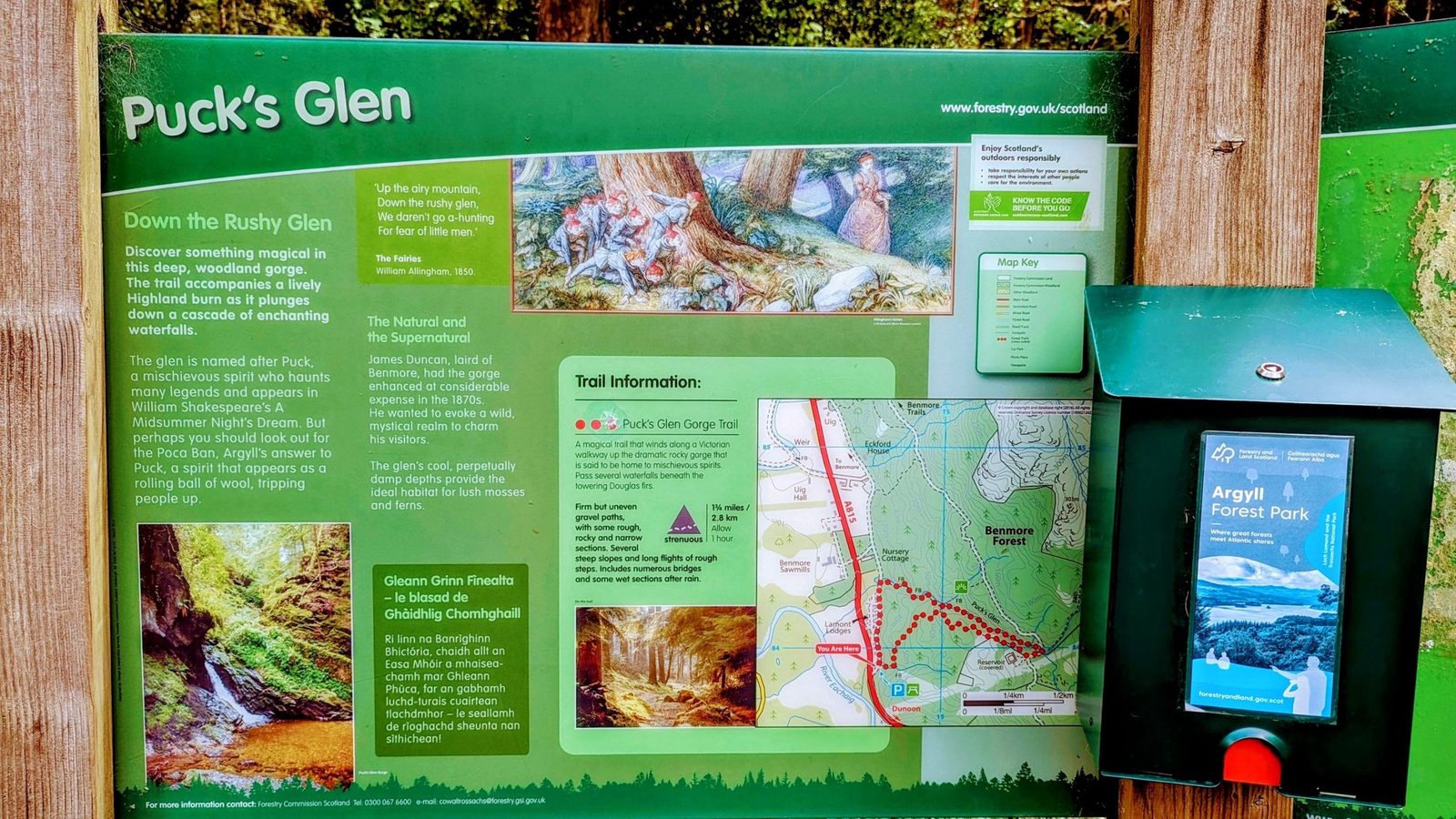 The 'Puck's Glen' trail information board showing a map of the gorge walk and forest routes.