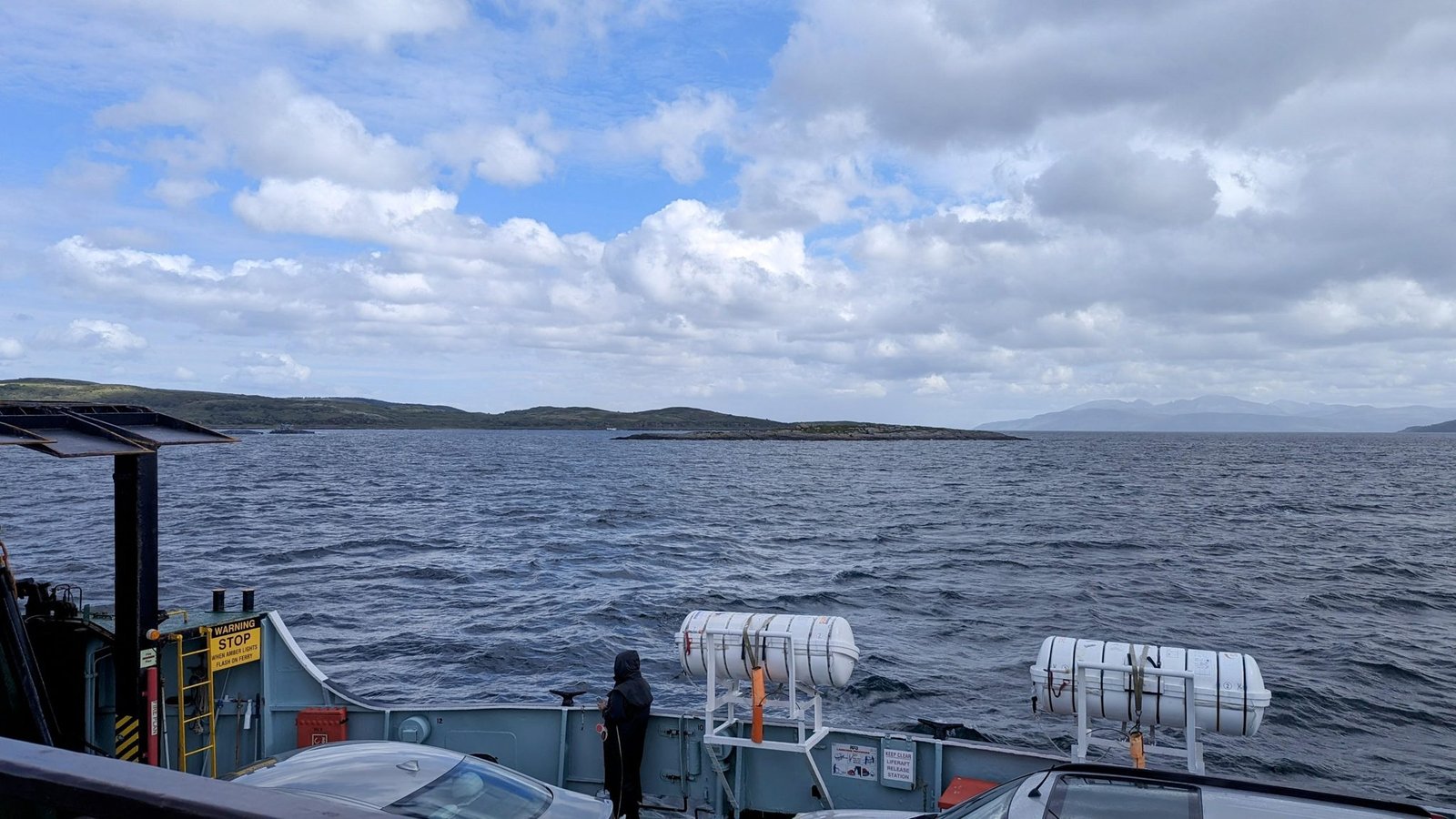 The view from the deck of the Isle of Cumbrae mid-crossing on Loch Fyne, hills on both shores.